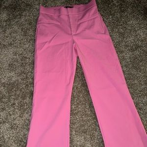 Pink flared pants.